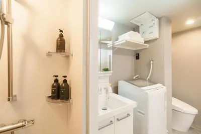 a small bathroom with a sink and a toilet at TORA HOTEL Kamata in Tokyo