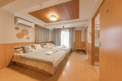 a bedroom with a large bed in a room at Ginza401 Tsukiji 3mins,Tsukiji Market in Tokyo