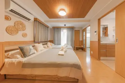 a bedroom with a large bed in a room at Ginza401 Tsukiji 3mins,Tsukiji Market in Tokyo