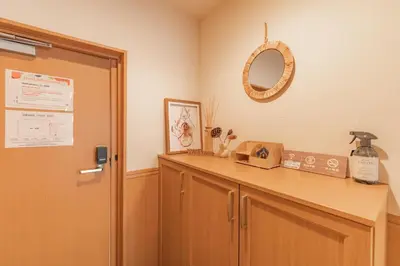 a room with a counter with a mirror and a door at Ginza401 Tsukiji 3mins,Tsukiji Market in Tokyo