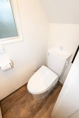 a bathroom with a white toilet and a window at Hale Akasaka - The House in Tokyo