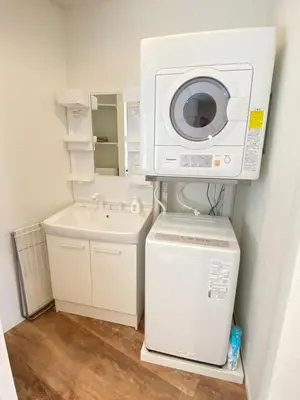 a laundry room with a washing machine and a washer at Hale Akasaka - The House in Tokyo