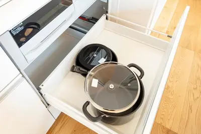 a round mirror sitting inside of a drawer at Hours House\u9ad8\u78021 in Tokyo