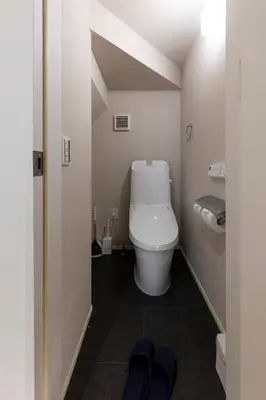a bathroom with a toilet in a small room at Hours House\u9ad8\u78021 in Tokyo