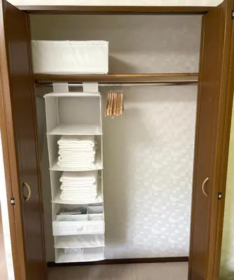 a closet with a door full of towels at #2 \u65b0\u5bbf\u307e\u30672\u5206 ! \u6e05\u6f54\u3067\u5b89\u5168\u306a\u90e8\u5c4b ! WiFi\u7121\u6599 ! in Tokyo