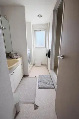 a small bathroom with a sink and a mirror at MUGI Stay 301 in Tokyo