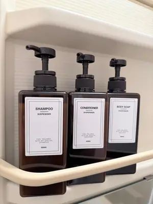 three bottles of soap sitting on a shelf at MUGI Stay 301 in Tokyo
