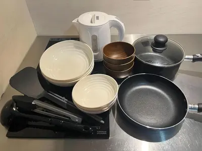 a counter top with pots and pans and a coffee maker at 201 Maison de Bohème Ryogoku in Tokyo