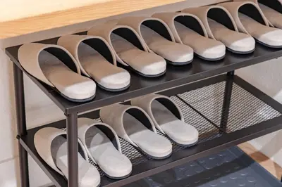 a row of shoes sitting on a shelf at \u4e80\u67095\u4e01\u76ee302 in Tokyo