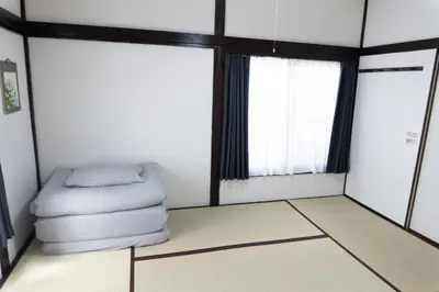 a room with a bed and a window at Skytree-House\u6771\u5411\u5cf6 in Tokyo
