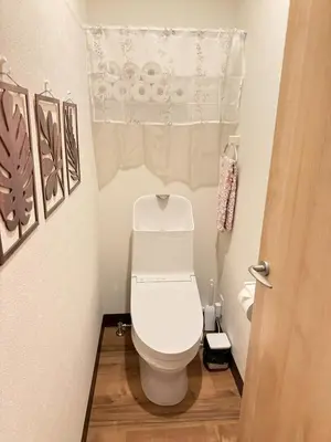 a small bathroom with a toilet and a curtain at Skytree-House\u6771\u5411\u5cf6 in Tokyo
