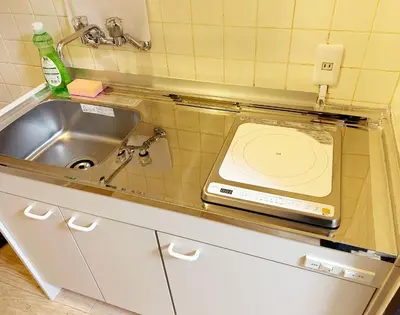 a kitchen counter with a sink and a sink at Shinmei Tokyo Omori in Tokyo