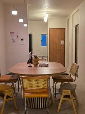 a dining room with a table and chairs at Sumika House in Asakusa , 5 minutes walk to asakusa ST ATION 5 bedrooms, 2 living room 2kitchen 4toilet 2bathroom 2washmachine 2fridge Newly renovated with ultra-fast WiFi in Tokyo