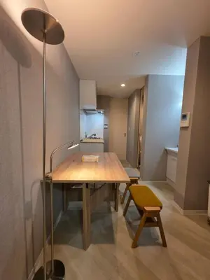 a dining room with a table and a yellow chair at Sumika House in Asakusa , 5 minutes walk to asakusa ST ATION 5 bedrooms, 2 living room 2kitchen 4toilet 2bathroom 2washmachine 2fridge Newly renovated with ultra-fast WiFi in Tokyo