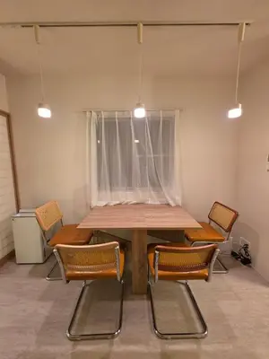 a dining room with a table and chairs at Sumika House in Asakusa , 5 minutes walk to asakusa ST ATION 5 bedrooms, 2 living room 2kitchen 4toilet 2bathroom 2washmachine 2fridge Newly renovated with ultra-fast WiFi in Tokyo