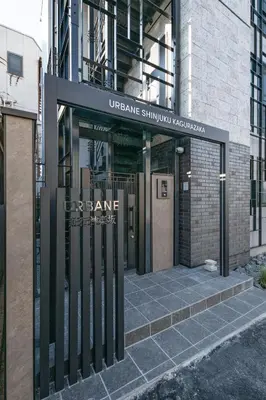 an entrance to a building with a sign on it at \u30a2\u30fc\u30d9\u30a4\u30f3\u65b0\u5bbf\u795e\u697d\u5742 in Tokyo