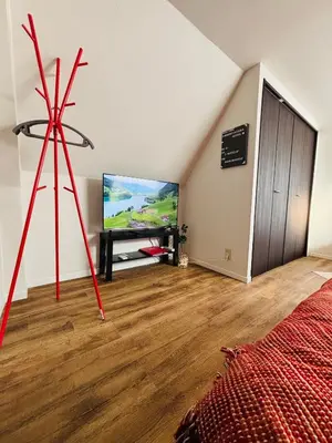 a room with a tv and a bed in a room at Shimokitazawa Cozy Apartment 401 in Tokyo