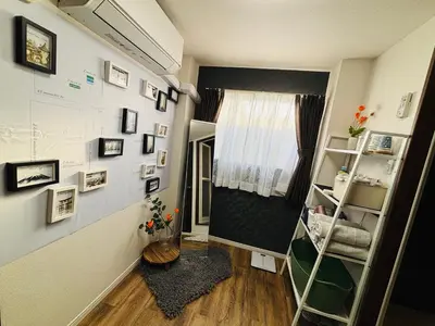 a small room with a shelf and a window at Shimokitazawa Cozy Apartment 401 in Tokyo