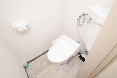 a bathroom with a white toilet in a stall at ACT Residence 101 2\u5ba41\u30b7\u30e3\u30ef1\u30c8\u30a4\u30ec\u65b0\u5bbf\u6587\u5316\u30bb\u30f3\u30bf\u30fc\u8fd1\u96a3 in Tokyo