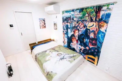 a bedroom with a large painting on the wall at Pierre-Auguste Renoir Tokyo Shibuya Shinjyuku 7min Free Wifi New Open in Tokyo