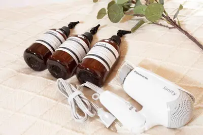 three bottles of wine sitting next to a hair dryer at Skytree View Heights in Tokyo