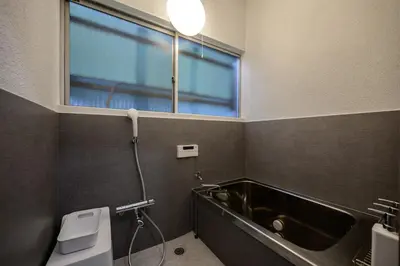 a bathroom with a bath tub and a window at Ueno Asakusa Area Spacious 90sqm Home Comfortable Tokyo Stay Up to 8 Guests in Tokyo