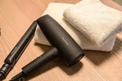 a hair brush and a hair dryer on a table at Ueno Asakusa Area Spacious 90sqm Home Comfortable Tokyo Stay Up to 8 Guests in Tokyo