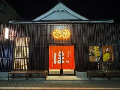 a building with a red door and two benches at Ueno Asakusa Area Spacious 90sqm Home Comfortable Tokyo Stay Up to 8 Guests in Tokyo