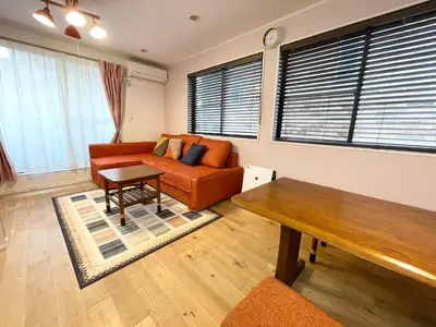 a living room with a couch and a table at Prime Shinjuku - 12min to Kabukicho - Quiet Park Area - Entire House - 3BD 6Beds - 70 sqm 750 sqft in Tokyo