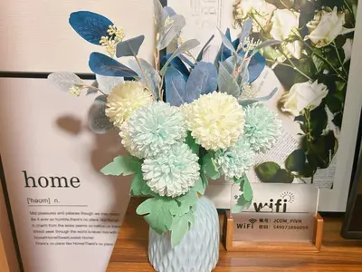 a vase filled with flowers sitting on a table at Newly built house with free parking, 3 minutes walk from Shinkoiwa Station in Tokyo