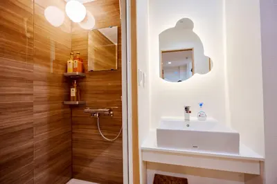 a bathroom with a white sink and a shower at M101 5-minute walk from Minowa Station on the Hibiya Line, straight to Ueno, Akihabara, Ginza in Tokyo