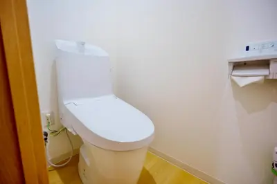 a bathroom with a white toilet in a room at M201 Hibiya Line, 5-minute walk to Minowa ! Straight line to Ueno, Akihabara ,and Roppongi! Family room for 5-6 people! in Tokyo