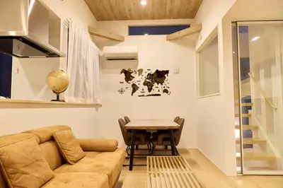 a living room with a couch and a table at Edelweiss 301 in Tokyo