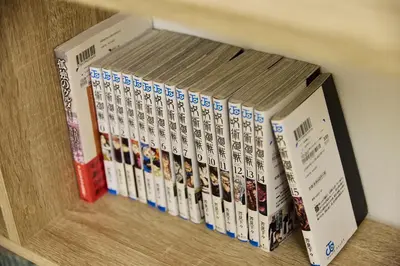 a row of books sitting on a shelf at Edelweiss 301 in Tokyo