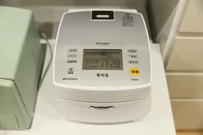 a digital scale sitting on a counter next to a appliance at Edelweiss 301 in Tokyo