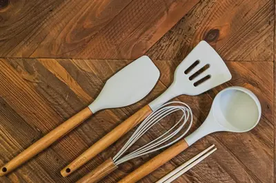 four utensils sitting on a wooden table at Kameido Saryo in Tokyo
