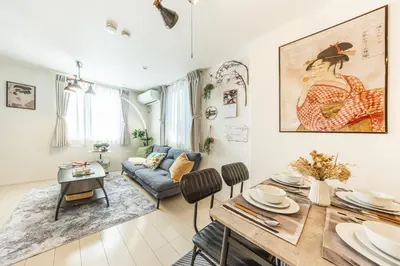 a living room with a table and a couch at Shinjuku Area Top-Tier Luxury, 4 min Walk to Station, Stay in a Traditional Japanese Beauty Ukiyo-e Art Villa, Shinjuku 13 min, Sleeps 8, Entire New 3BR House, 60sqm, Free Parking, Roppongi and Tsukiji direct access in Tokyo