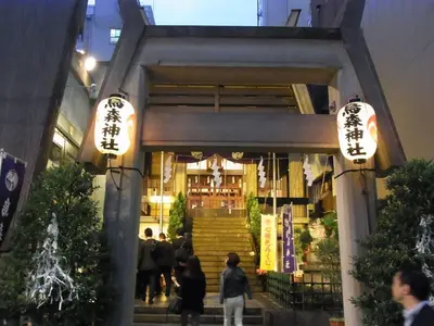 a store front with people walking outside of it at night at SHINBASHI Station A major hub station ideal for Tokyo sightseeing Numerous restaurants and eateries surround the station Enjoy your stay on the top floor of the building without worrying about noise Elevator available in Tokyo