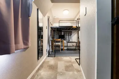 a hallway with a bunk bed in a room at SHINBASHI Station A major hub station ideal for Tokyo sightseeing Numerous restaurants and eateries surround the station Enjoy your stay on the top floor of the building without worrying about noise Elevator available in Tokyo