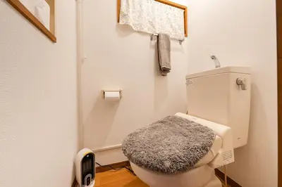 a bathroom with a toilet with a blanket on it at Asakusa, Ueno, Akihabara MAX 6 guests Entire building rental Ideal base for Tokyo sightseeing Manga, games, large-screen TV in Tokyo