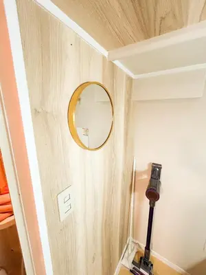 a mirror on a wall with a camera on it at 103 Shin Okubo area & Quiet stay in central of Tokyo in Tokyo