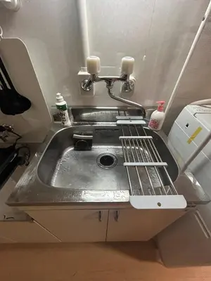 a metal sink in a room with at 103 Shin Okubo area & Quiet stay in central of Tokyo in Tokyo