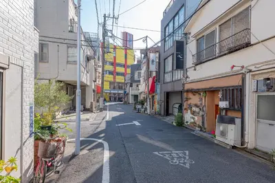 an empty street in a city with buildings at \u6d45\u8349\u30de\u30a4\u30db\u30c6\u30eb Asakusa My apartment Hotel in Tokyo