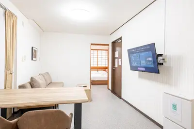 a hospital room with a tv on the wall at \u6d45\u8349\u30de\u30a4\u30db\u30c6\u30eb Asakusa My apartment Hotel in Tokyo