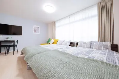 a bedroom with a bed and a desk and a window at Astra Nakano hostel max6 people NN0494 in Tokyo