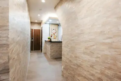 a hallway with a stone wall at Astra Nakano hostel max6 people NN0494 in Tokyo