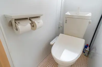 a bathroom with a white toilet and a sink at 203Room 1 Stop from Ikebukuro Entire 35m on 2st Floor 2 Bedrooms for up to 6 Guests 3Minute Walk to Don Quijote in Tokyo