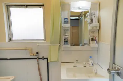 a bathroom with a sink and a mirror at 203Room 1 Stop from Ikebukuro Entire 35m on 2st Floor 2 Bedrooms for up to 6 Guests 3Minute Walk to Don Quijote in Tokyo