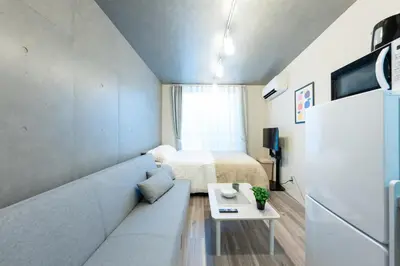 a small room with a bed and a table at Tokyo 3min Gotanno Station couples friends 20sqm in Tokyo