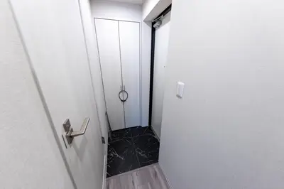 a small bathroom with a walk in shower next to a door at Tokyo 3min Gotanno Station couples friends 20sqm in Tokyo